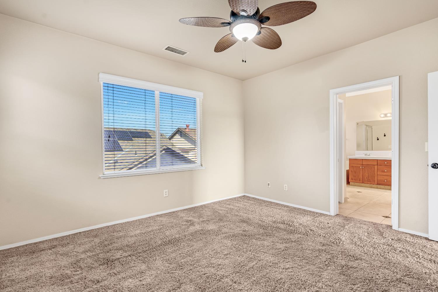 5629 North Citrus Lane Fresno, CA 93711 - Photo 20 of 35 an empty room with fan and windows