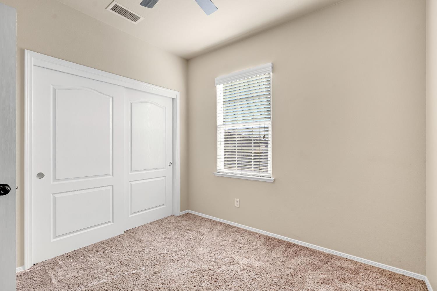 5629 North Citrus Lane Fresno, CA 93711 - Photo 27 of 35 an empty room with windows