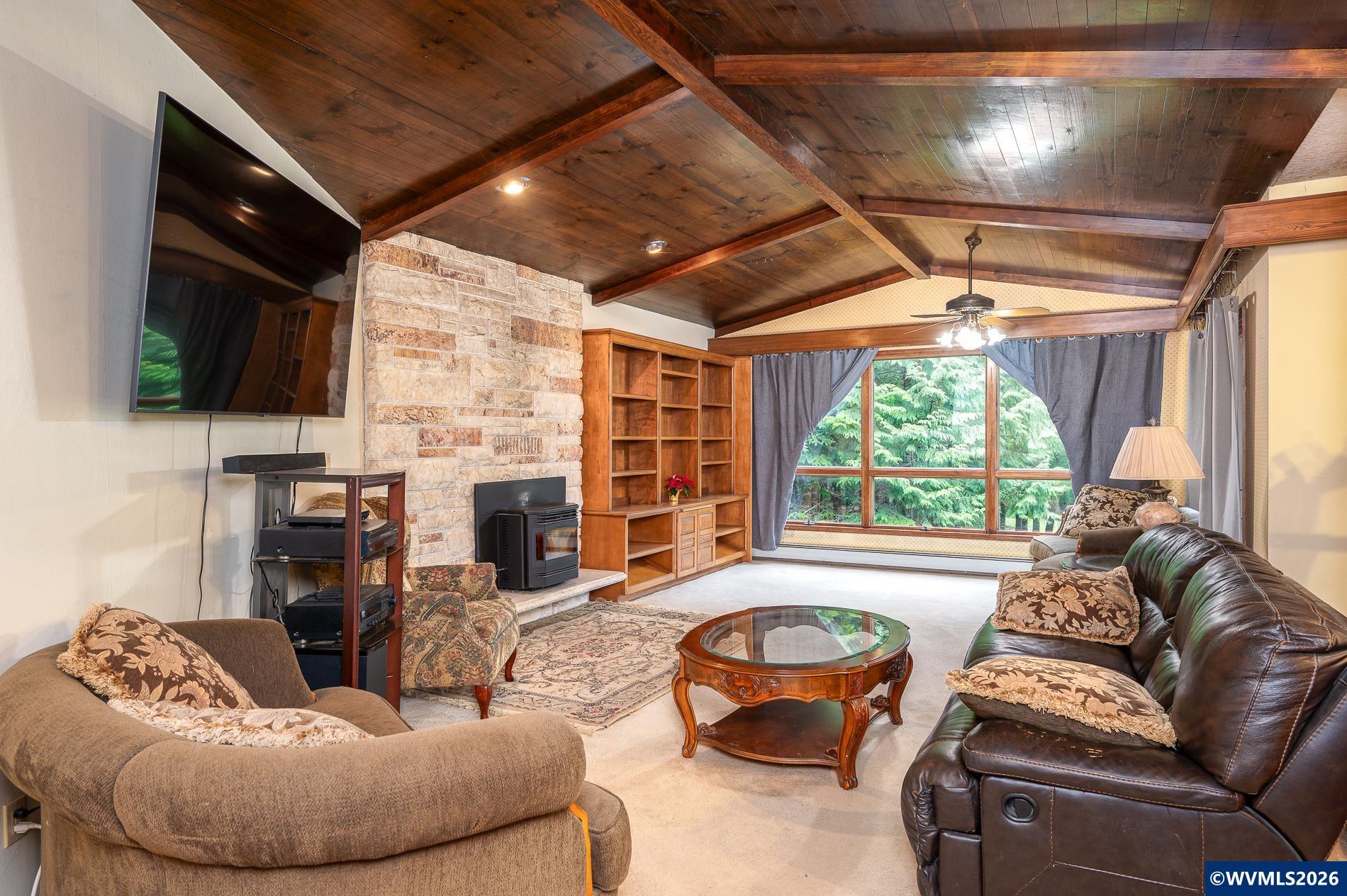 27572 South Kinzy Road Estacada, OR 97023 - Photo 6 of 50 a living room with fireplace furniture and a large window