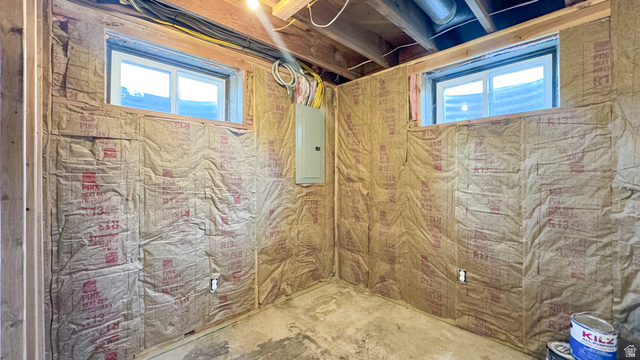 120 North 1230 E Street Springville, UT 84663 - Photo 33 of 60 Unfinished basement space featuring two windows, exposed wood framing, insulation, and a visible electrical panel