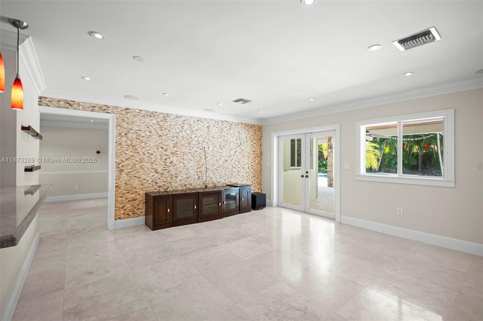 8260 Southwest 95th Street Miami, FL 33156 - Photo 16 of 50 an empty room with windows and chandelier