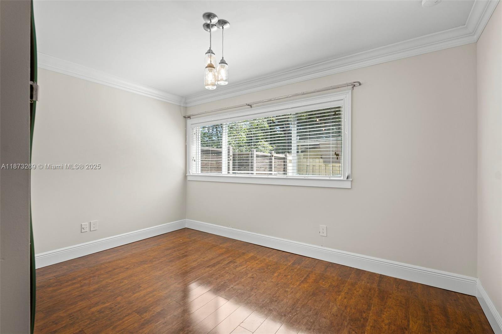 8260 Southwest 95th Street Miami, FL 33156 - Photo 32 of 50 a view of empty room with wooden floor and fan
