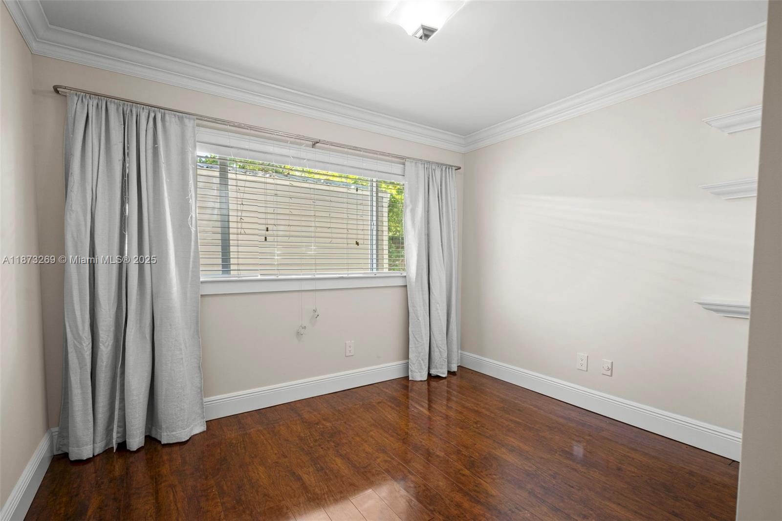 8260 Southwest 95th Street Miami, FL 33156 - Photo 34 of 50 an empty room with wooden floor and windows