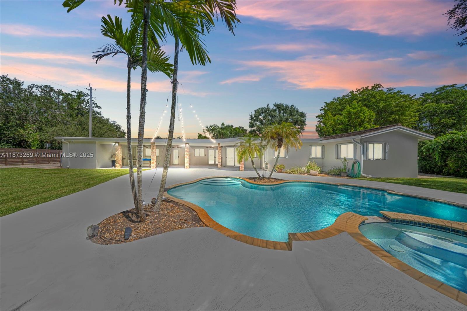 8260 Southwest 95th Street Miami, FL 33156 - Photo 38 of 50 a swimming pool with outdoor seating and yard