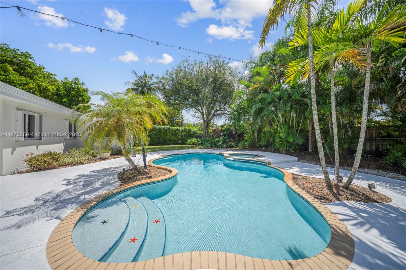 8260 Southwest 95th Street Miami, FL 33156 - Photo 40 of 50 a view of a swimming pool with a patio and plants