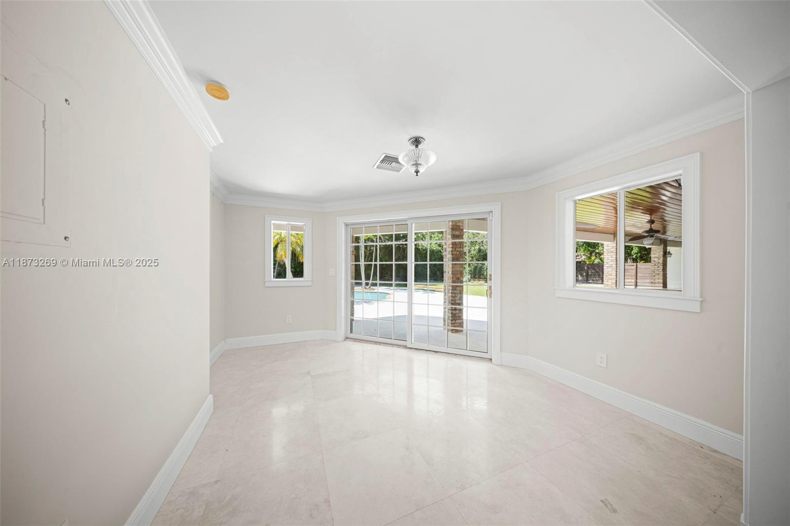 8260 Southwest 95th Street Miami, FL 33156 - Photo 4 of 50 a view of an empty room with a window