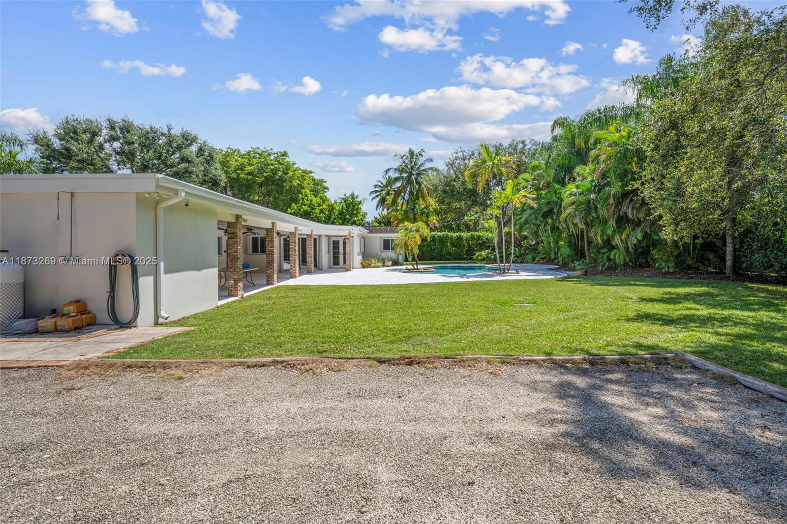 8260 Southwest 95th Street Miami, FL 33156 - Photo 43 of 50 a view of a house with backyard and trees