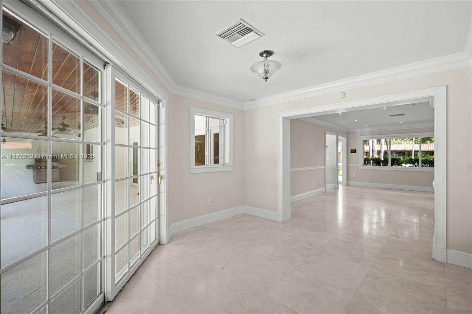 8260 Southwest 95th Street Miami, FL 33156 - Photo 5 of 50 a view of an empty room with a window