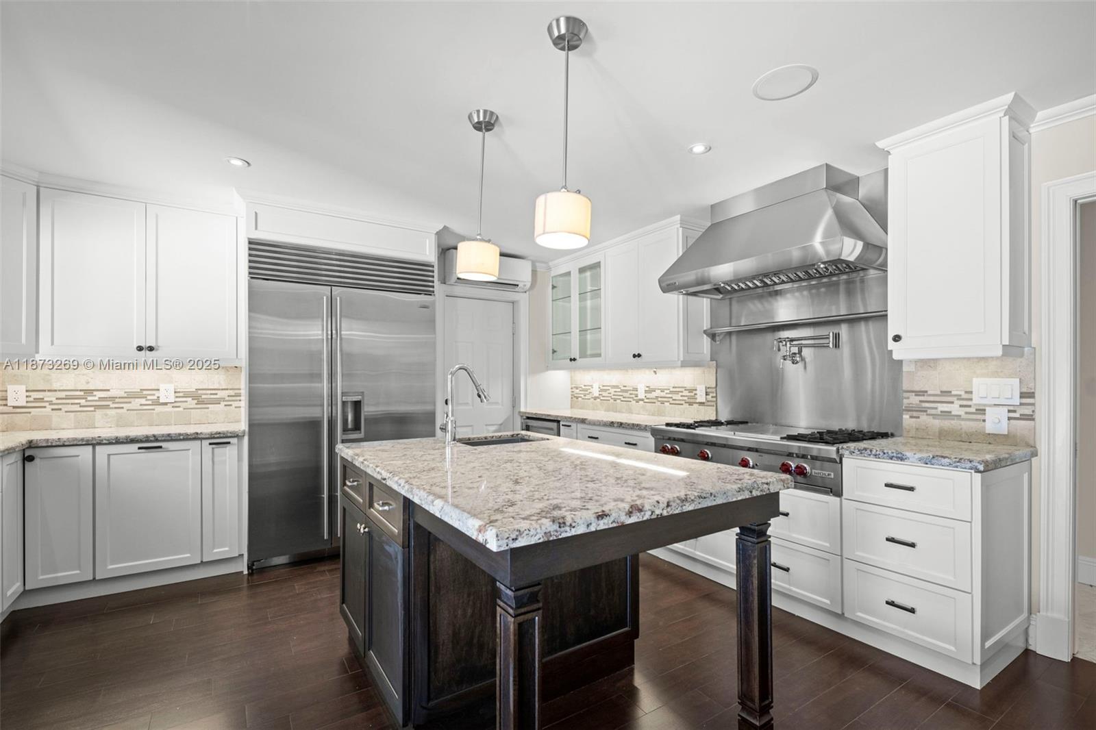 8260 Southwest 95th Street Miami, FL 33156 - Photo 9 of 50 a kitchen with a stove a refrigerator and cabinets