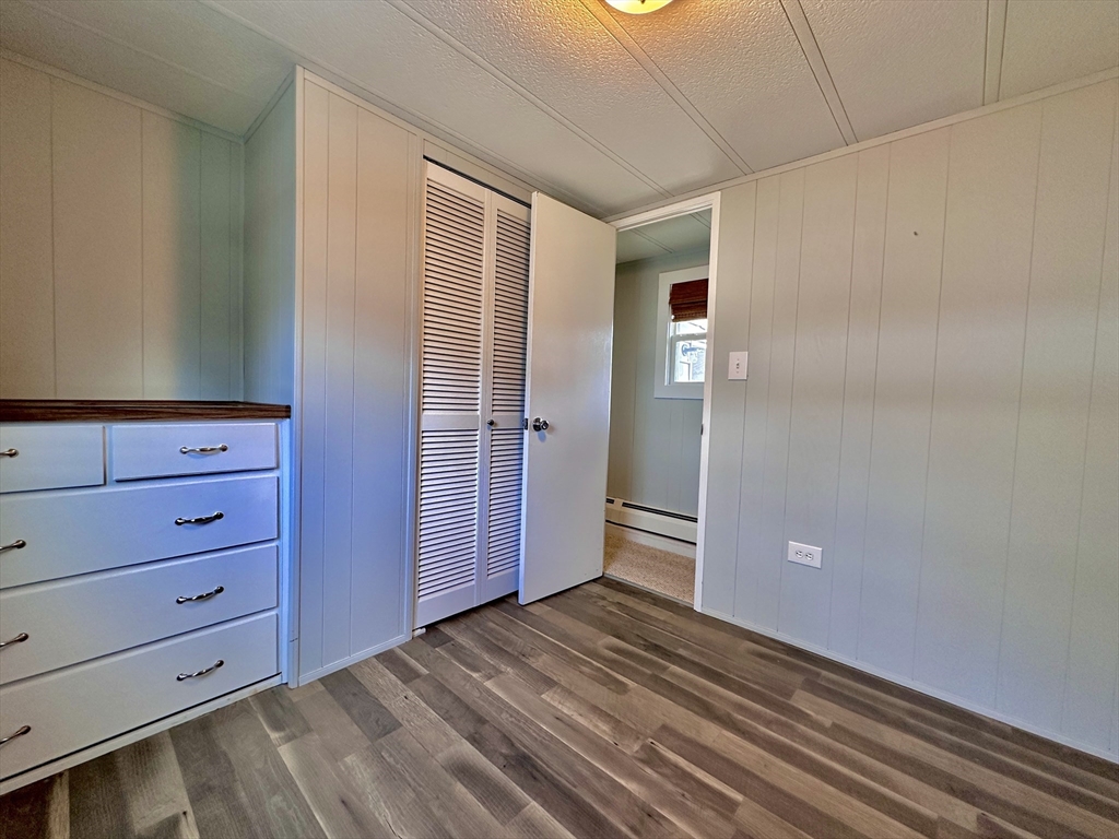 27 Windswept Road Wareham, MA 02576 - Photo 12 of 34 a view of an empty room with wooden floor