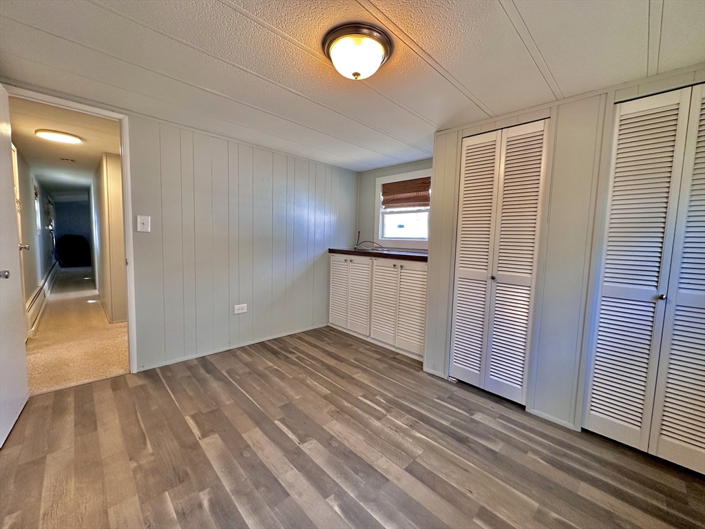 27 Windswept Road Wareham, MA 02576 - Photo 22 of 34 wooden floor in an empty room with a window