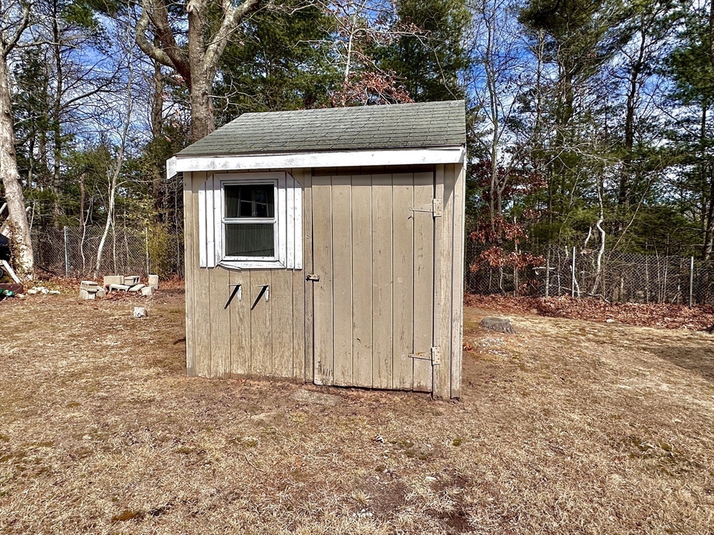 27 Windswept Road Wareham, MA 02576 - Photo 24 of 34 a front view of a house with a yard