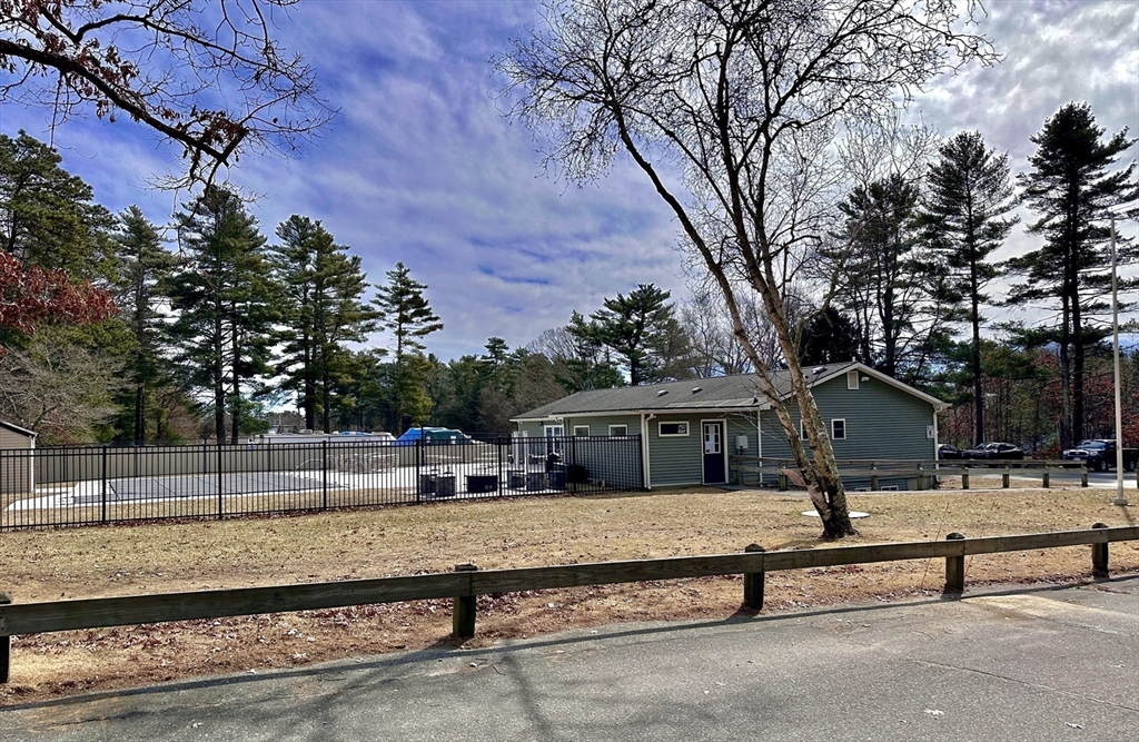 27 Windswept Road Wareham, MA 02576 - Photo 27 of 34 a view of a terrace with a bench