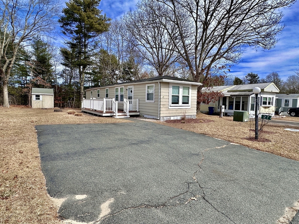 27 Windswept Road Wareham, MA 02576 - Photo 31 of 34 a front view of a house with a yard and trees