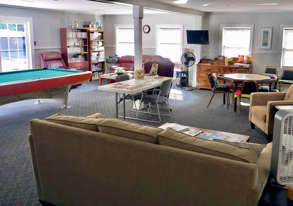 27 Windswept Road Wareham, MA 02576 - Photo 33 of 34 a living room with furniture and a flat screen tv