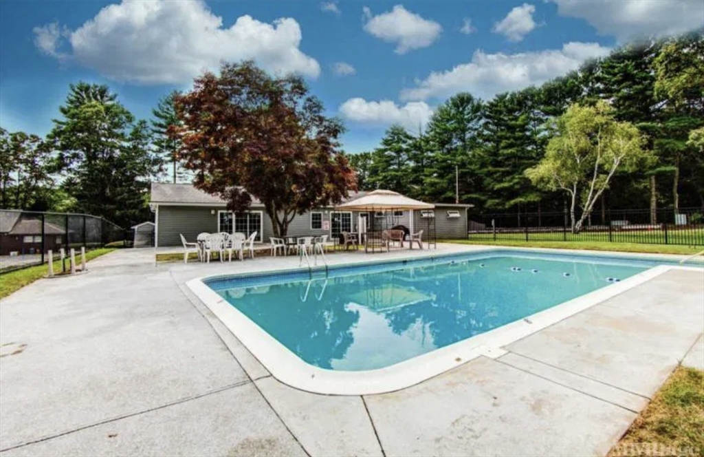 27 Windswept Road Wareham, MA 02576 - Photo 34 of 34 a view of a swimming pool with a yard