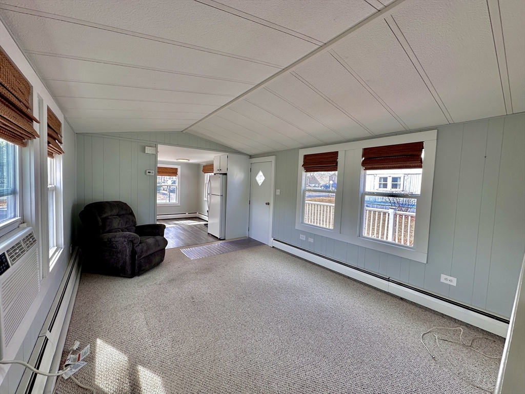 27 Windswept Road Wareham, MA 02576 - Photo 6 of 34 a living room with furniture and a large window