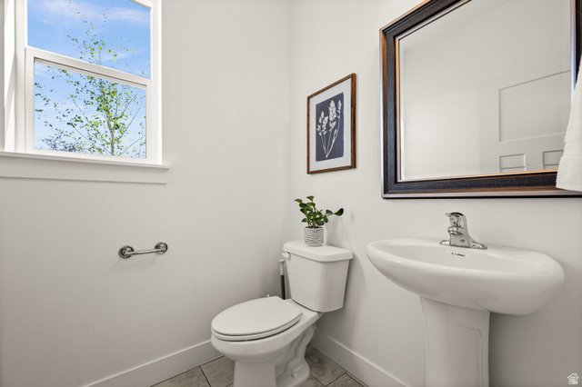 14728 South Canyon Pointe Road Draper, UT 84020 - Photo 14 of 35 Pedestal sink with chrome faucet, complemented by a framed mirror with dark wood-finish trim