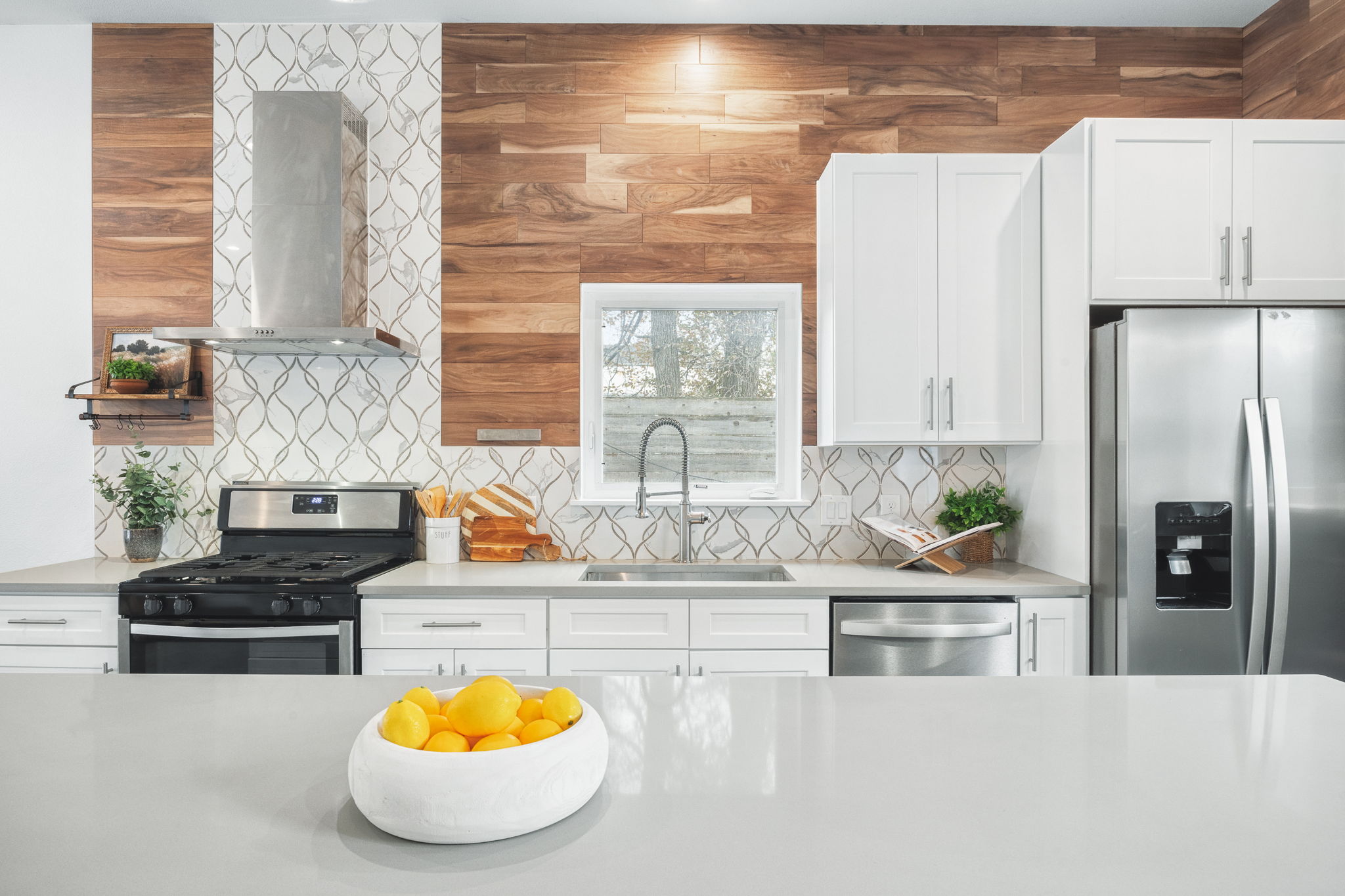 1218 Eleanor Street, Unit 1 Austin, TX 78721 - Photo 12 of 39 a kitchen with stainless steel appliances granite countertop a sink a stove and a refrigerator