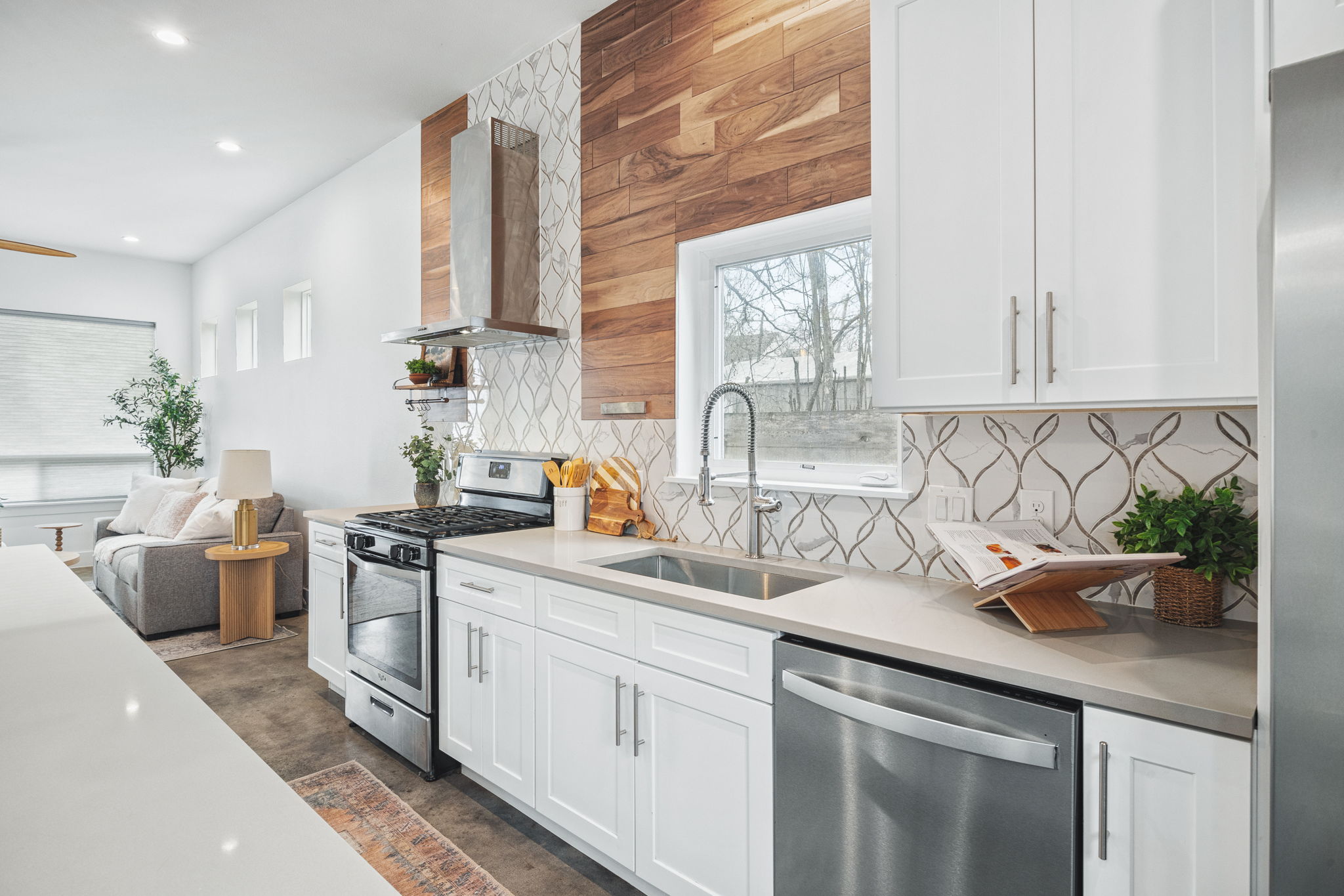 1218 Eleanor Street, Unit 1 Austin, TX 78721 - Photo 14 of 39 a kitchen with a sink stove and cabinets