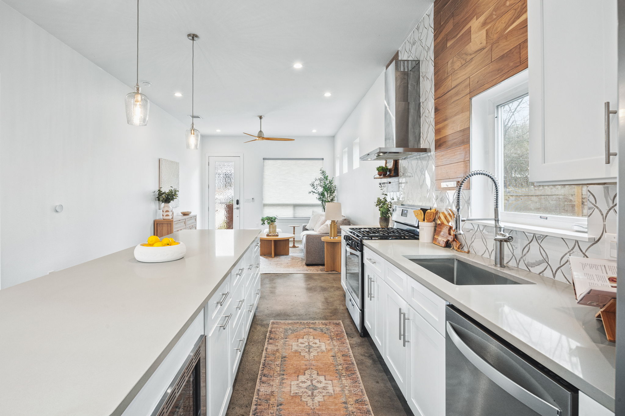 1218 Eleanor Street, Unit 1 Austin, TX 78721 - Photo 15 of 39 a kitchen with stainless steel appliances granite countertop a sink and stove