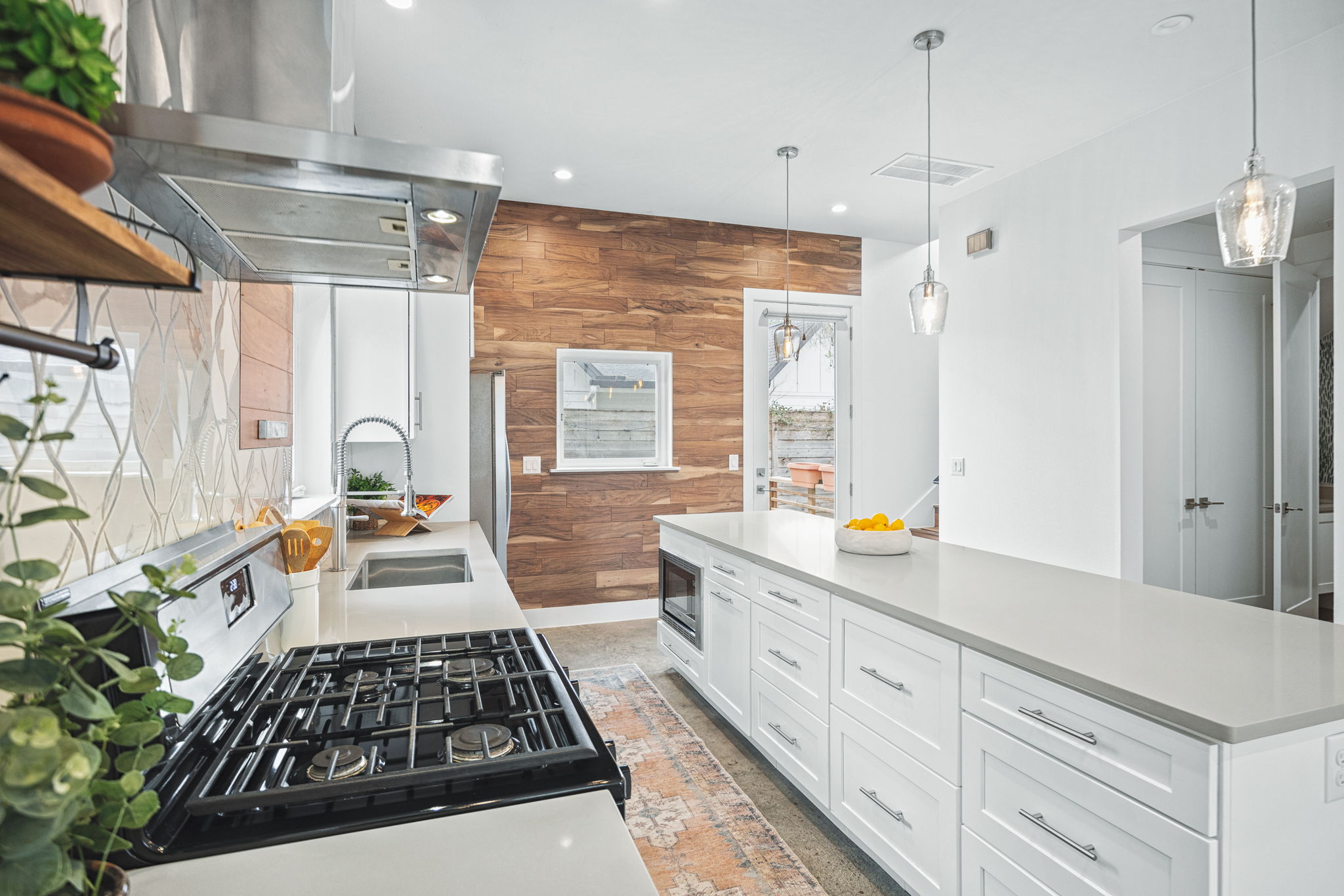 1218 Eleanor Street, Unit 1 Austin, TX 78721 - Photo 17 of 39 a large white kitchen with a large window