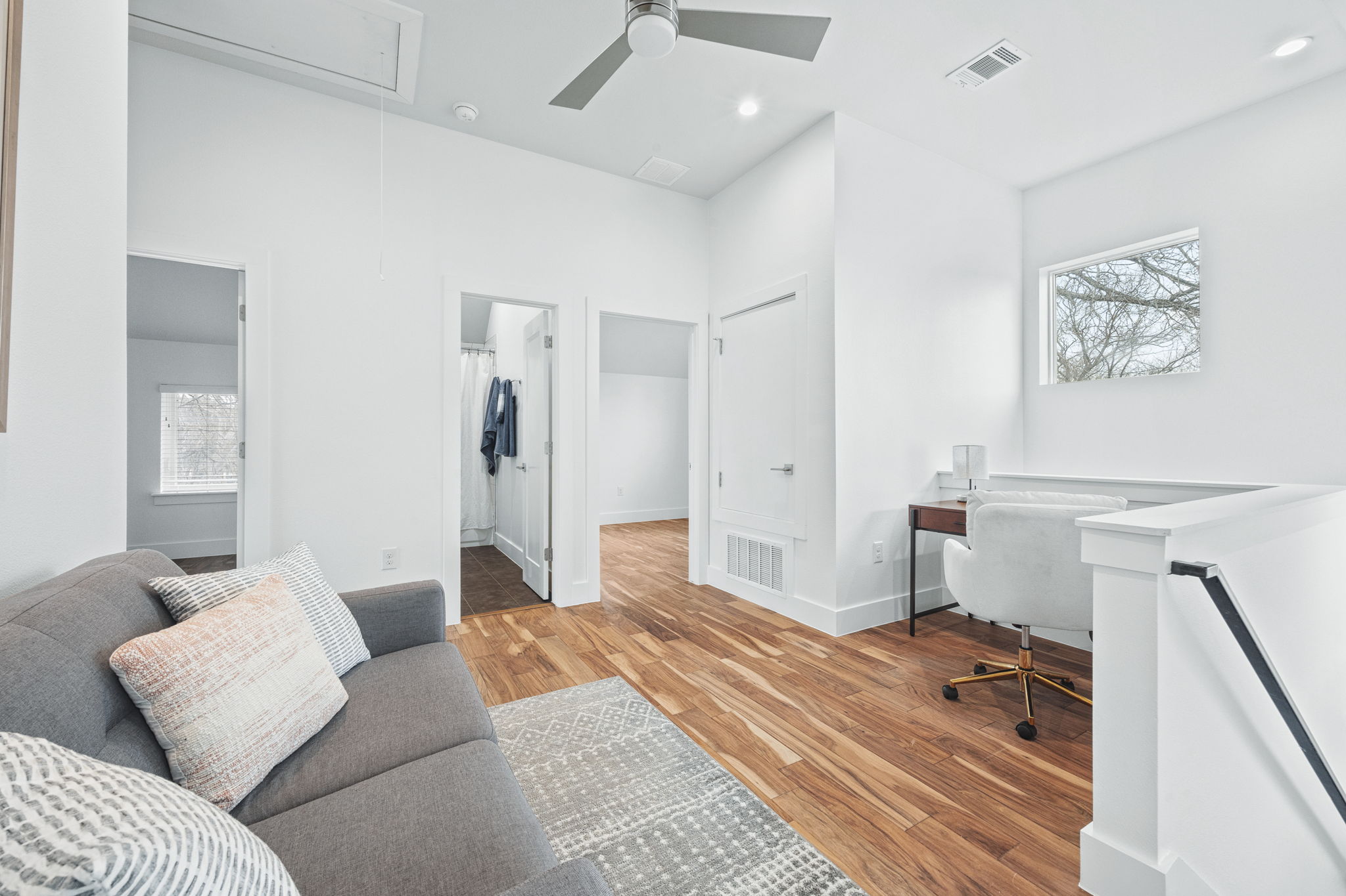 1218 Eleanor Street, Unit 1 Austin, TX 78721 - Photo 20 of 39 a bedroom with a bed and a couch