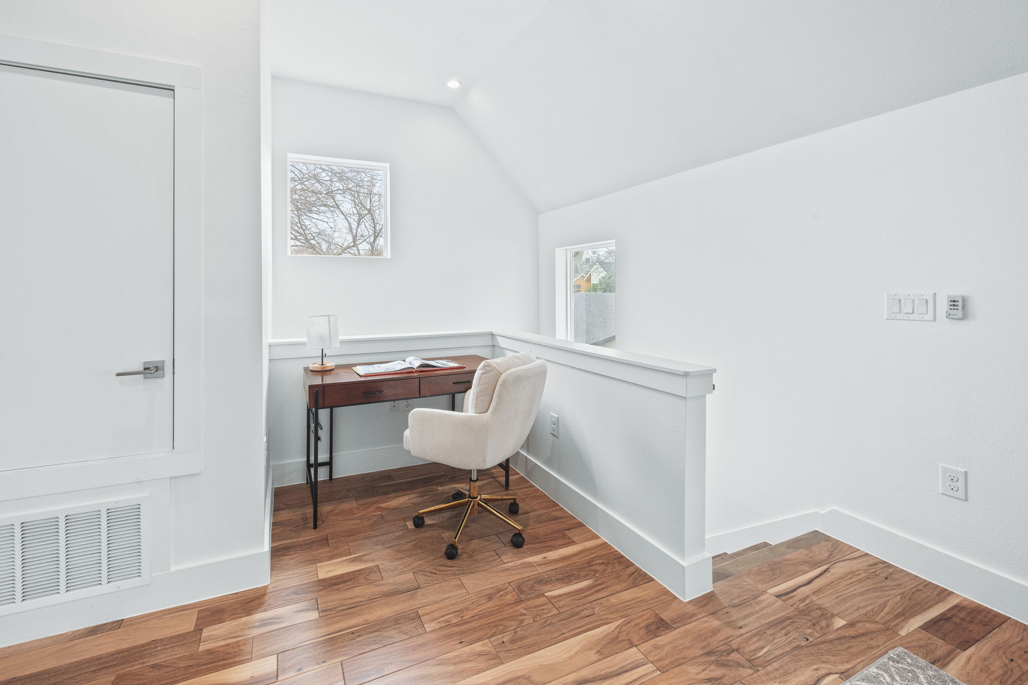 1218 Eleanor Street, Unit 1 Austin, TX 78721 - Photo 22 of 39 a workspace with wooden floor and a workspace