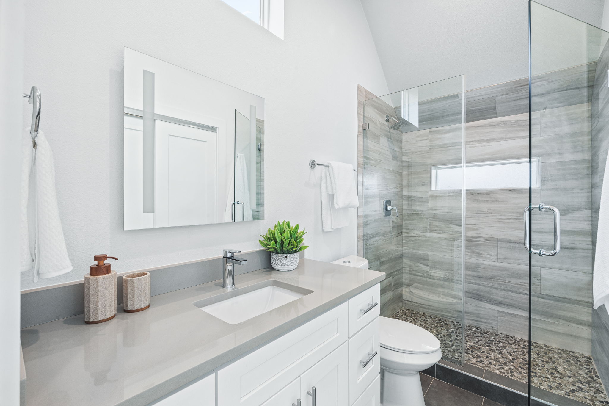 1218 Eleanor Street, Unit 1 Austin, TX 78721 - Photo 28 of 39 a bathroom with a granite countertop sink mirror and toilet