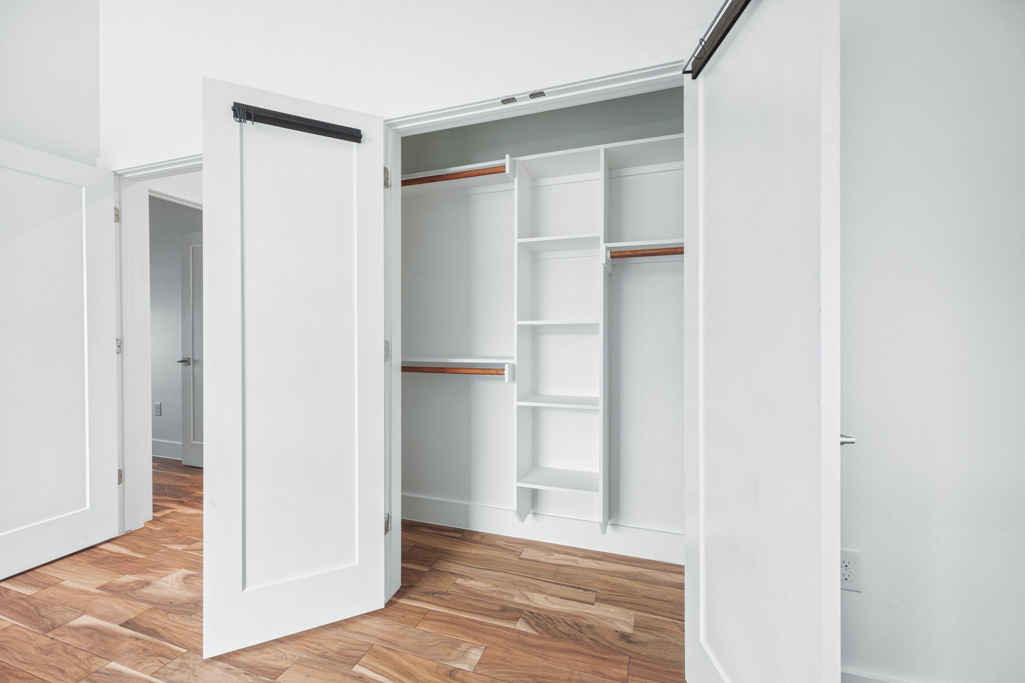1218 Eleanor Street, Unit 1 Austin, TX 78721 - Photo 29 of 39 a view of an empty room with wooden floor and closet