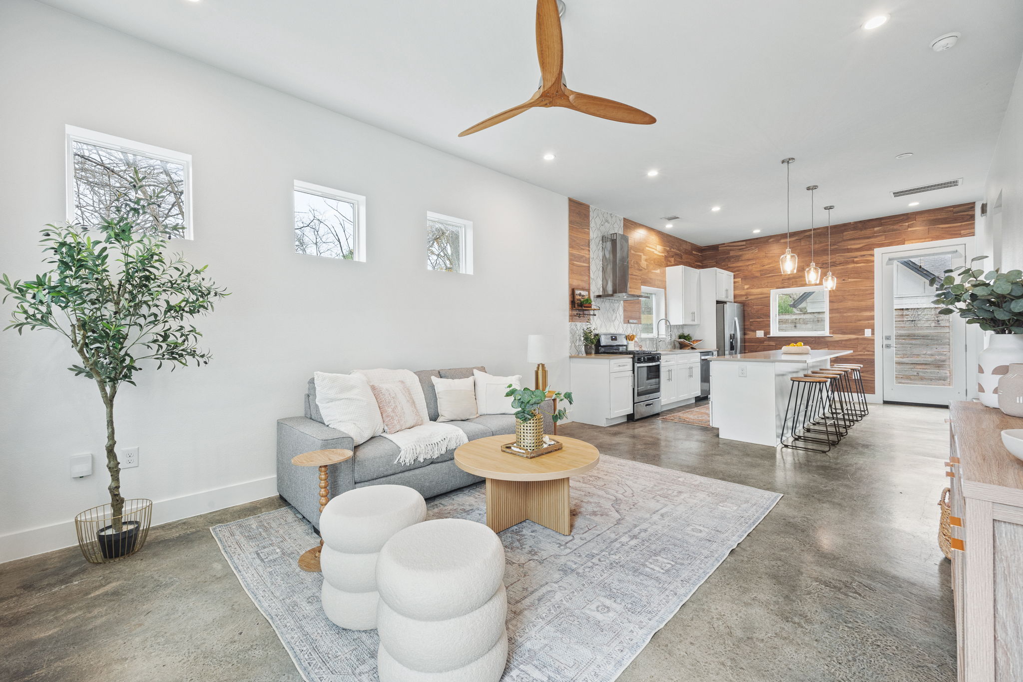 1218 Eleanor Street, Unit 1 Austin, TX 78721 - Photo 3 of 39 a living room with furniture and a potted plant