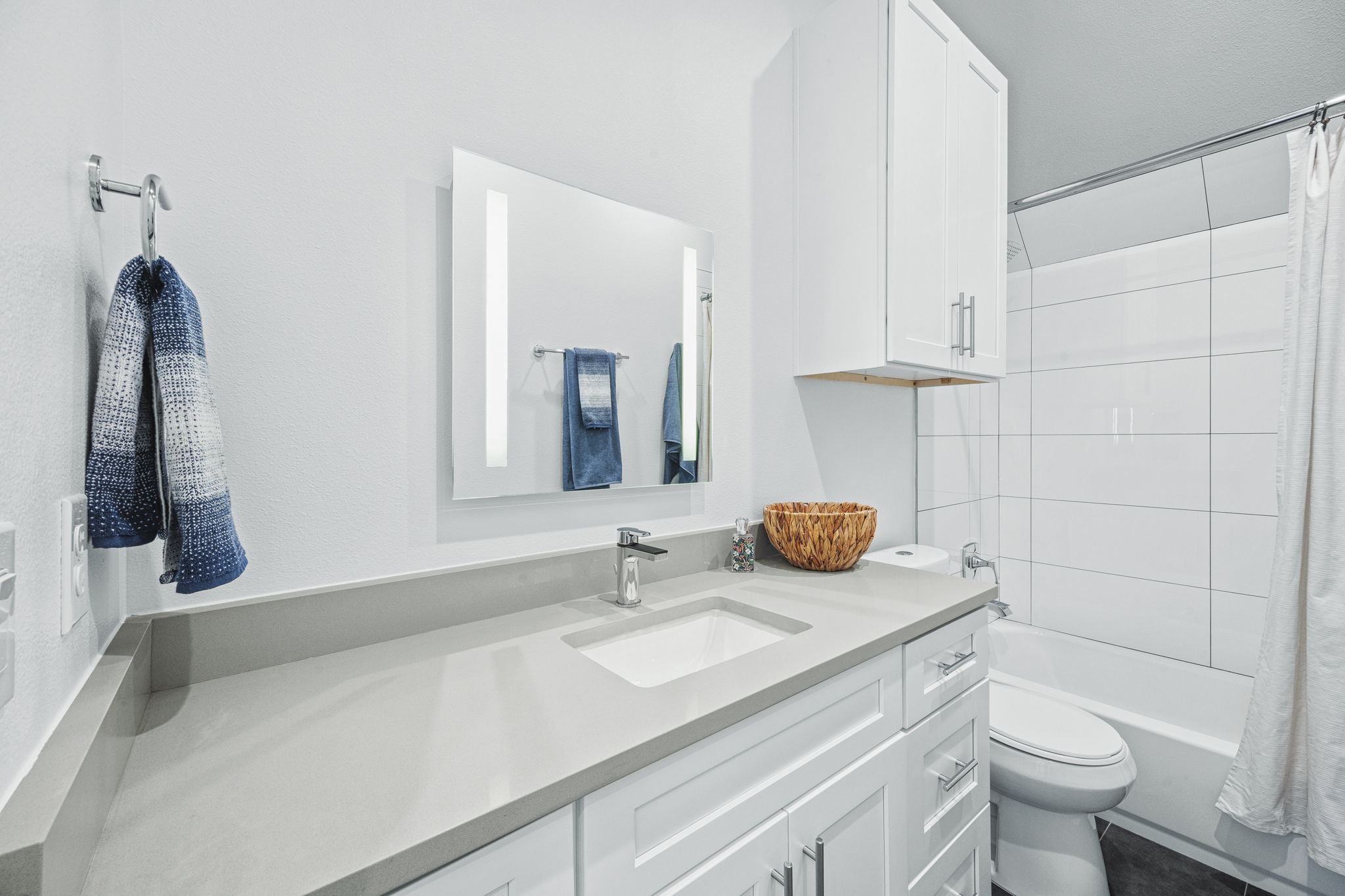 1218 Eleanor Street, Unit 1 Austin, TX 78721 - Photo 31 of 39 a bathroom with a granite countertop sink and a toilet