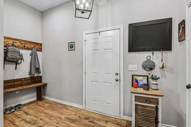 a view of an entryway with wooden floor