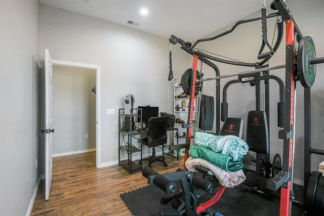 a living room with furniture or wooden floor and a ceiling fan
