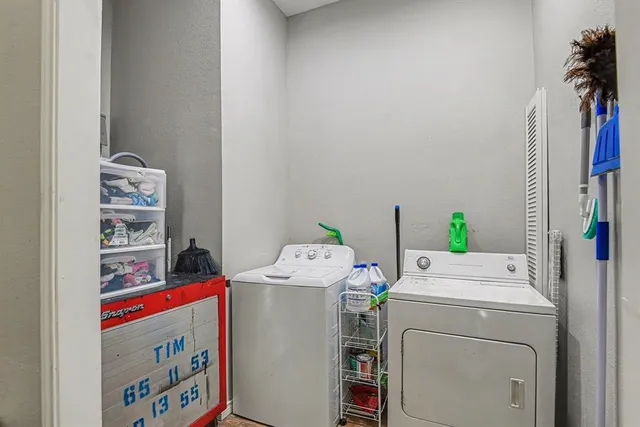 a utility room with dryer and washer