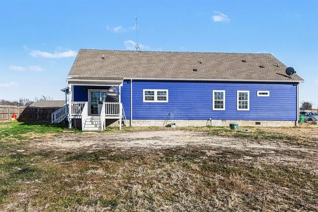 a view of a brick house with a yard