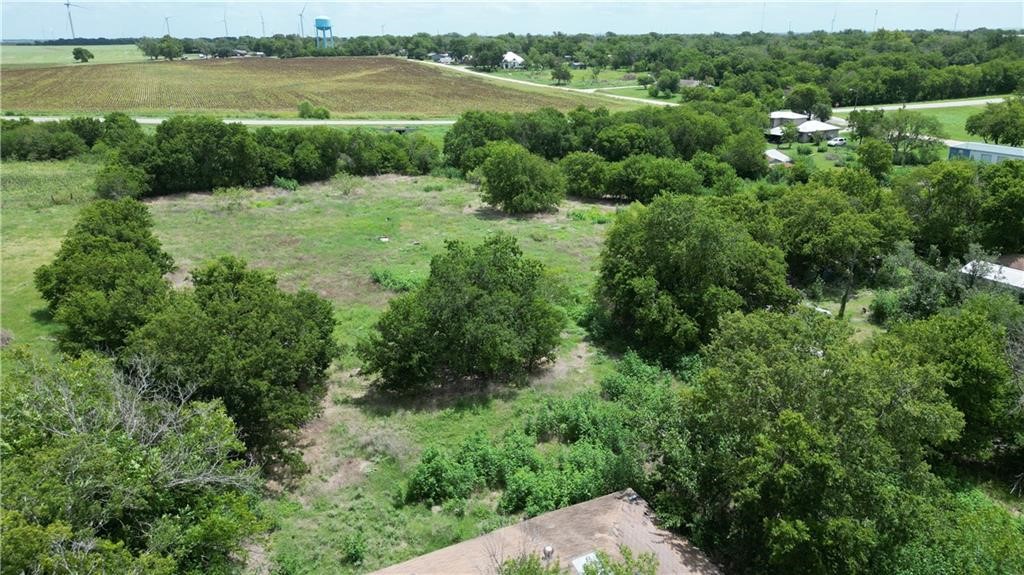 a view of a green field with an outdoor space