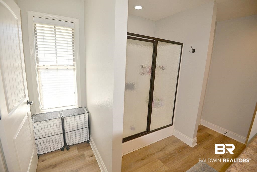 11201 Herschel Loop Daphne, AL 36526 - Photo 25 of 32 Bathroom featuring wood-type flooring and walk in shower