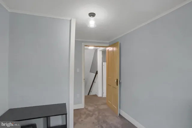 a view of a room with a hallway