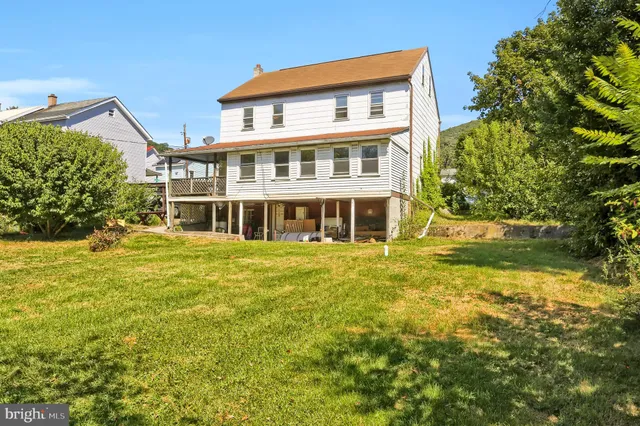 a backyard of a house with lots of green space