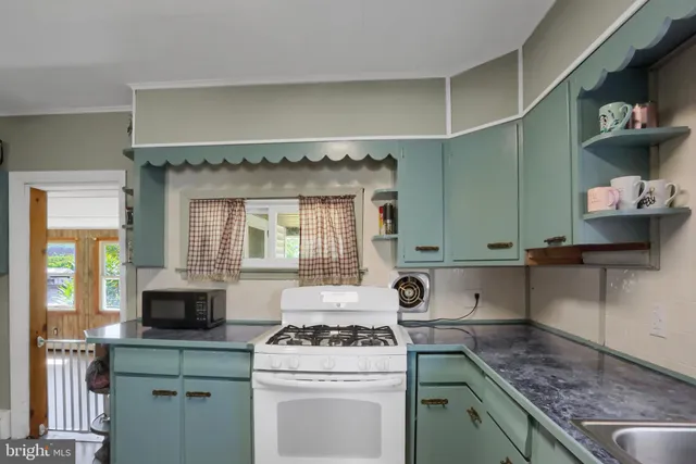 a kitchen with a stove and a sink