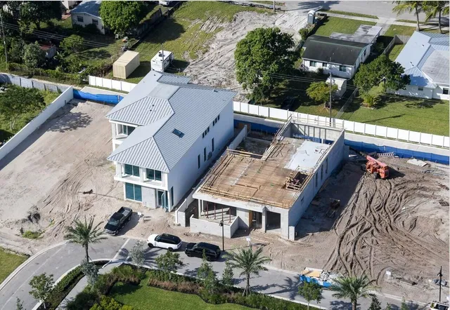 an aerial view of residential houses with outdoor space