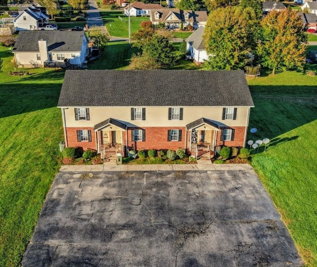 110 Mason Street Portland, TN 37148 - Photo 1 of 24 an aerial view of a house with a yard