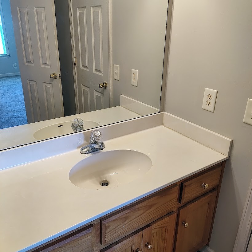 110 Mason Street Portland, TN 37148 - Photo 21 of 24 a bathroom with a sink and a mirror