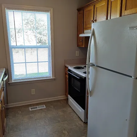 a kitchen with a stove and a cabinet