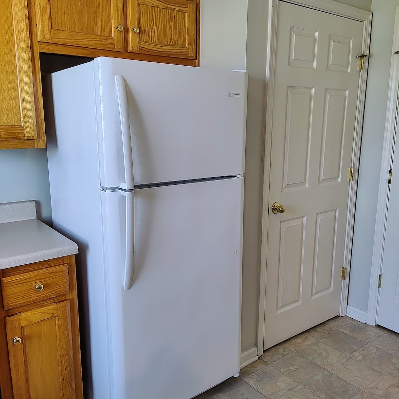 110 Mason Street Portland, TN 37148 - Photo 7 of 24 a white refrigerator freezer sitting in a kitchen