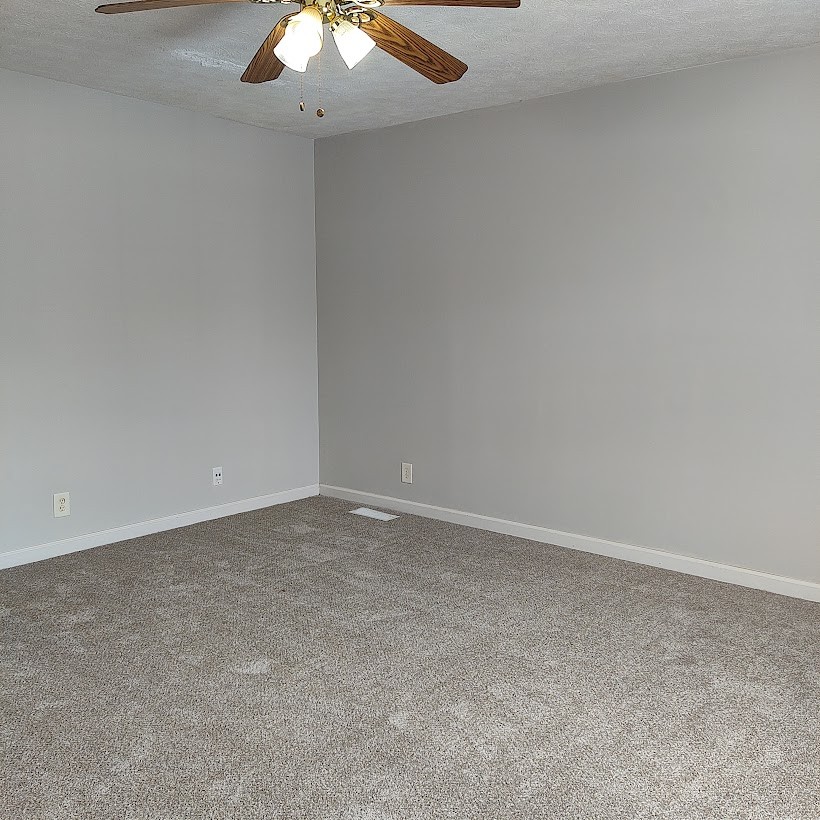 110 Mason Street Portland, TN 37148 - Photo 10 of 24 an empty room with a chandelier fan