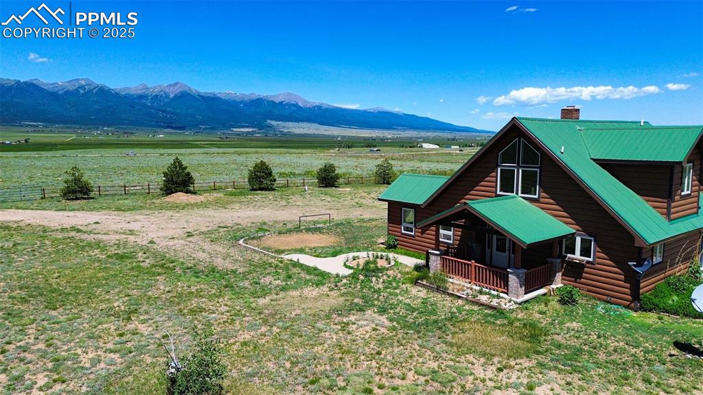 207 Howe Road Westcliffe, CO 81252 - Photo 2 of 48 a backyard of a house with a yard and lake view