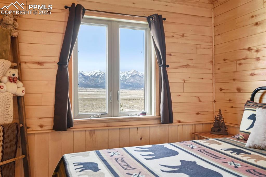 207 Howe Road Westcliffe, CO 81252 - Photo 26 of 48 a bedroom with a bed and a window
