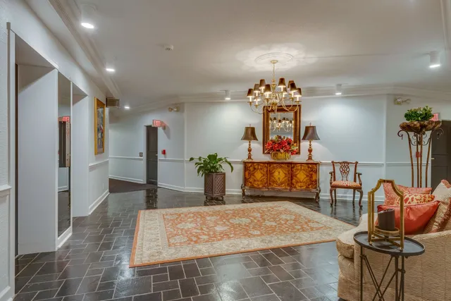 a front view of a building with trees